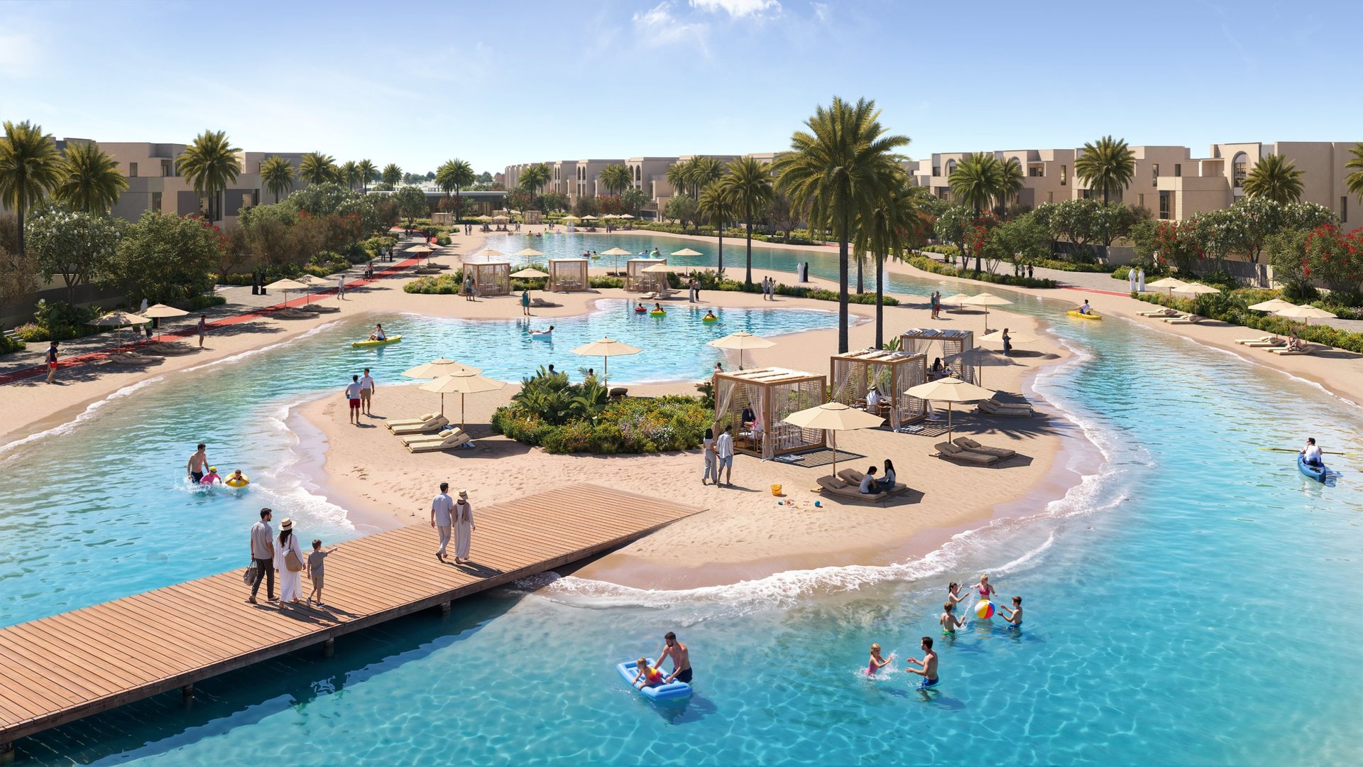 Families on a boardwalk and children playing in the shallow water of the lagoon